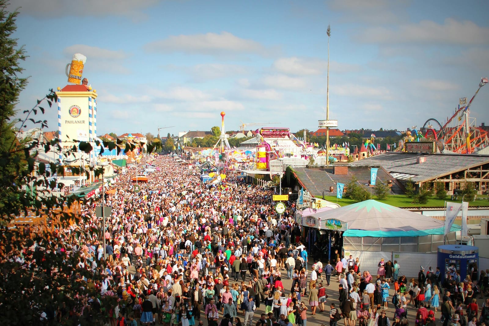 Crowded Oktoberfest fairground and beer tents at Theresienwiese in Munich